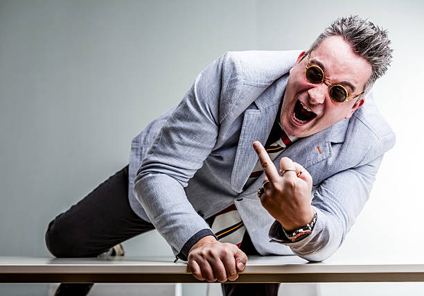 istock angry crazy businessman showing middle finger 543994558