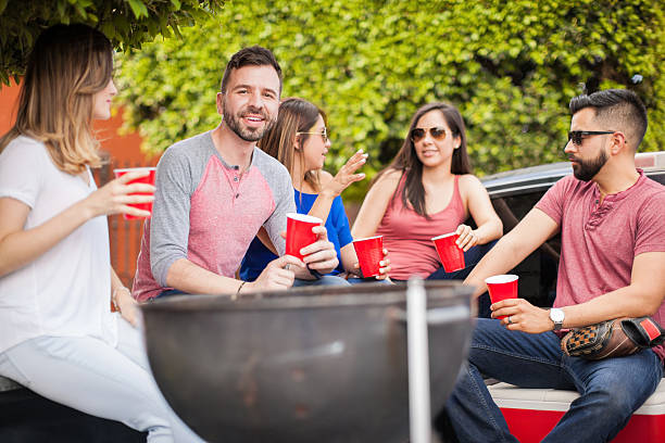 istock Young man at a barbecue with his friends 543995982
