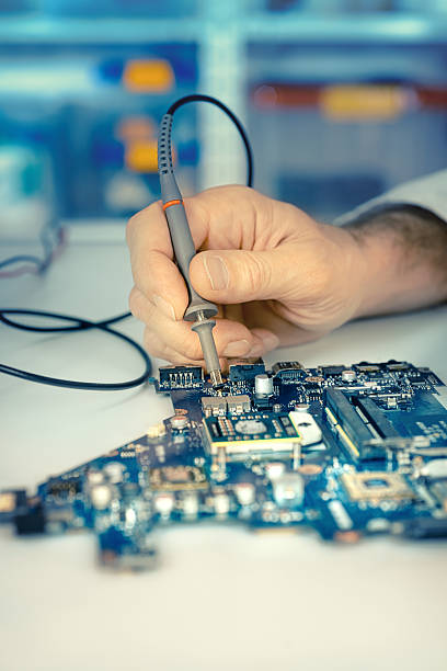 istock Closeup on the hands of tech checking motherboard 543996326