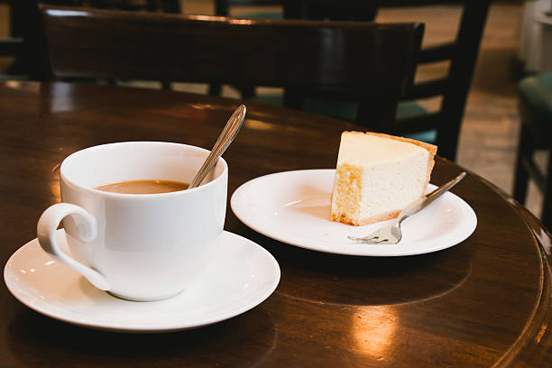 istock Coffee cup and Cheesecake in coffee shop 543996792