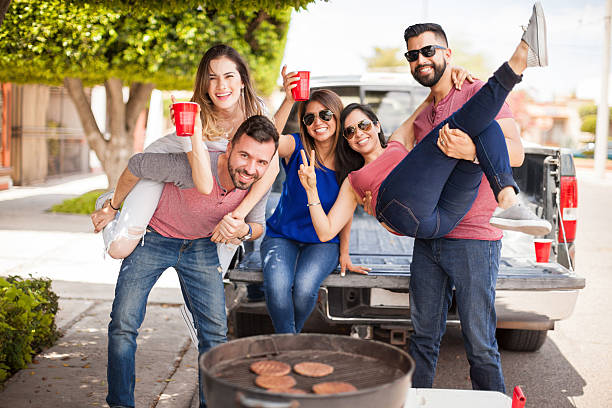 istock Group of people tailgating and grilling burgers 543996930