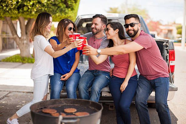 istock Group of people making a toast with plastic cups 543997214