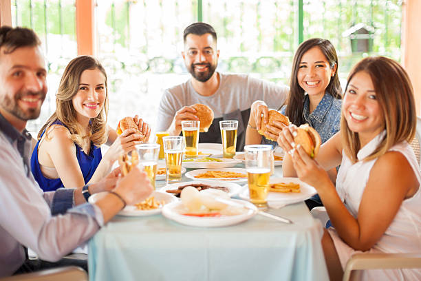 istock Group of people eating hamburgers 543997408