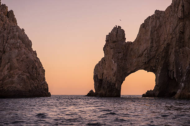 istock Sunset over the Arch in Cabo San Lucas. 543997568