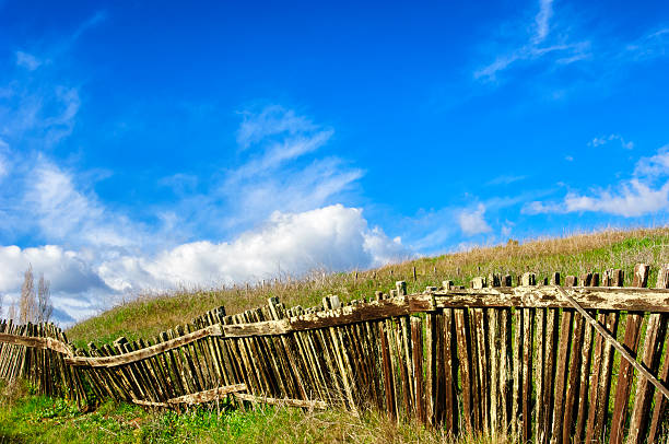 istock Rustic Wood Fence Against Cloudy Blue Sky 543998014