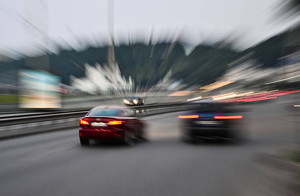 Evening city street racing cars blurred motion stock photo