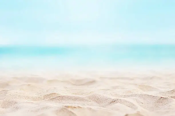 Close up sand with blurred sea sky background, summer day