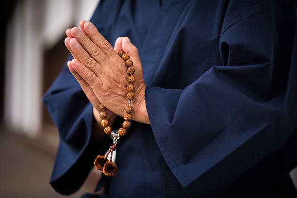 istock Senior hands with prayer beads 543999560