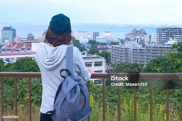 Young Woman Looking At Her Town Stock Photo - Download Image Now - Japanese Ethnicity, Rear View, Student