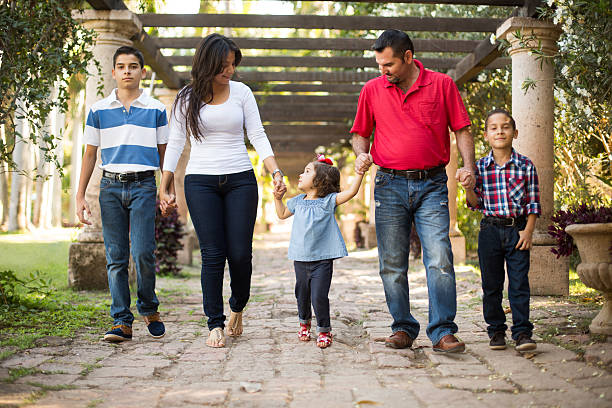 istock Latin family walking hand by hand 544002330