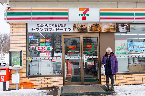 11 straniero in piedi fuori dal negozio di niseko - foreigner foto e immagini stock