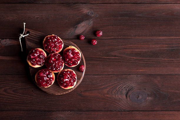 summer small cakes on wooden background, flat lay, top view