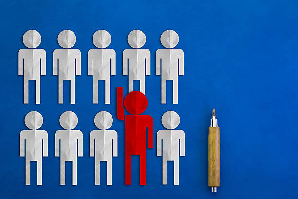 istock leader concept with red man paper cut on blue background 544094408