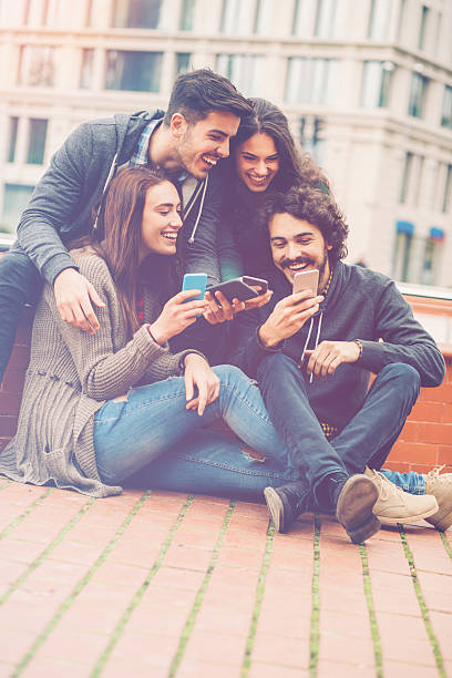 istock Group of friends with smart phones 544095990