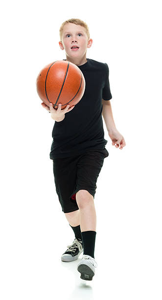 istock Little boy playing with basketball 544100070