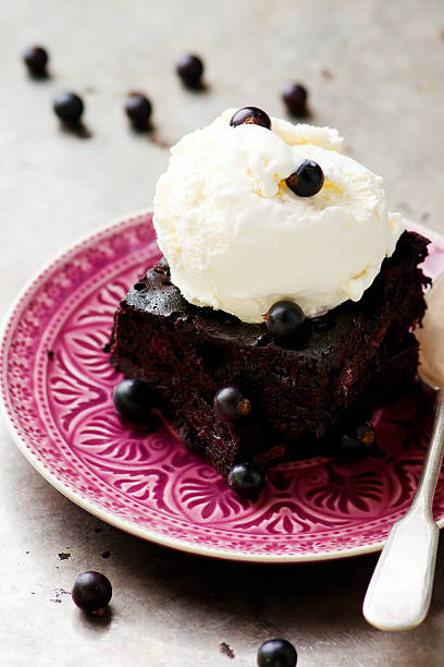 istock chocolate Brownie with ice cream and blackberry. 544101882