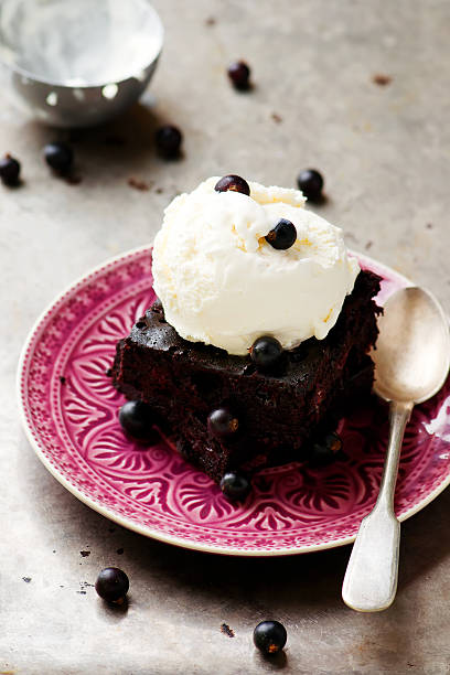 istock chocolate Brownie with ice cream and blackberry. 544101916