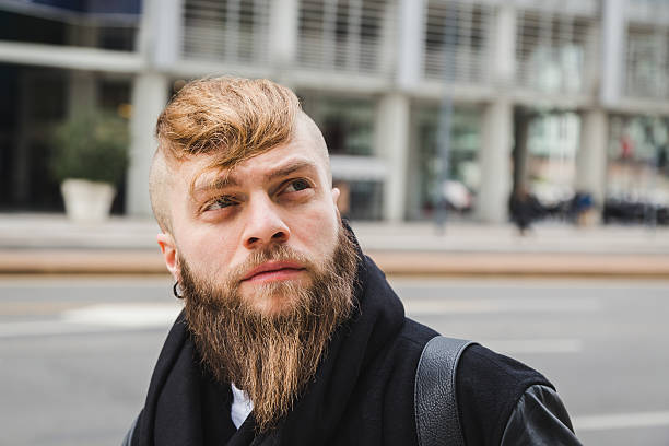 istock Stylish bearded man posing in the street 544102370