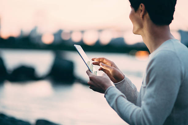 istock Young japanese man texting on the tablet 544102800