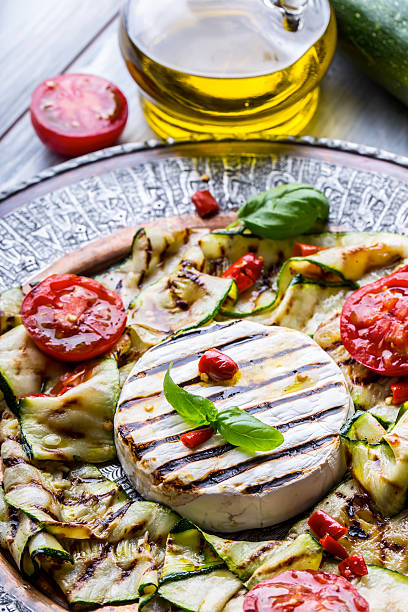 istock Grill Brie camembert cheese zucchini with chili pepper. 544105106