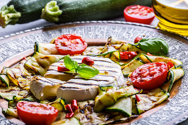 istock Grill Brie camembert cheese zucchini with chili pepper. 544105594