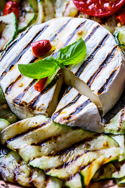 istock Grill Brie camembert cheese zucchini with chili pepper. 544105718