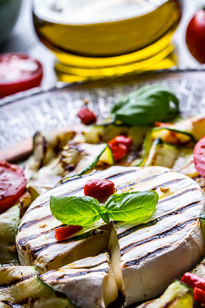 istock Grill Brie camembert cheese zucchini with chili pepper. 544105768