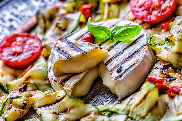 istock Grill Brie camembert cheese zucchini with chili pepper. 544106264