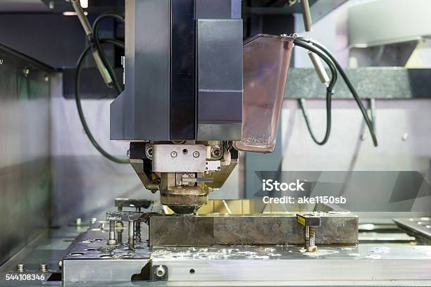 Edm Industrial Machine Working With Coolant Injection In Factory Stock Photo - Download Image Now