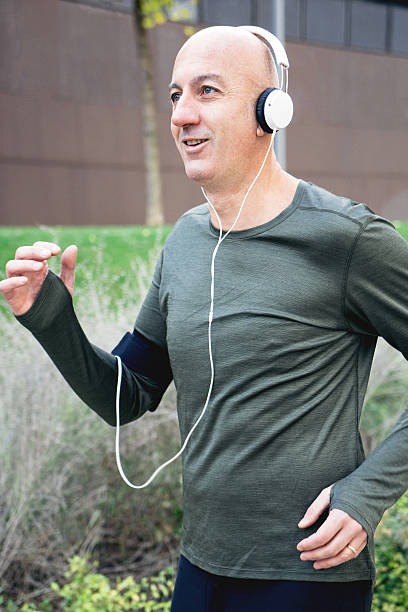 istock Mature Man Running Outdoors Wearing Sport Clothes 544109998