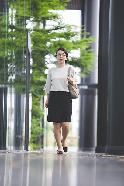 istock Confident businesswoman walking 544110056