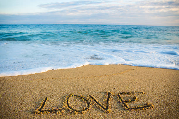 istock travel concept - word love written in sand 544110080