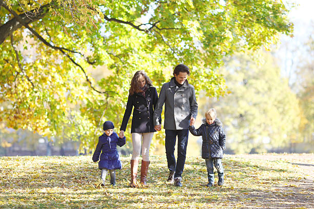 istock Family in autumn park 544110460