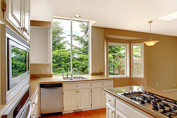istock Small classic American kitchen interior with white cabinets 544111378