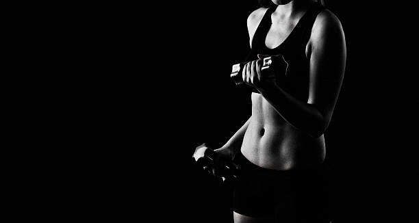 istock fitness woman on black background 544111652