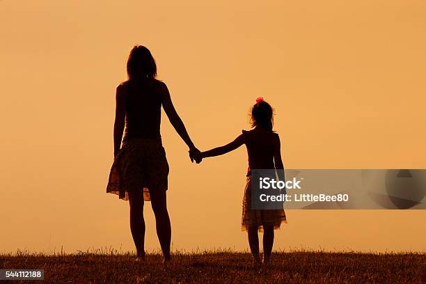 Precious Family Moments Stock Photo - Download Image Now - Mother, Holding Hands, Daughter