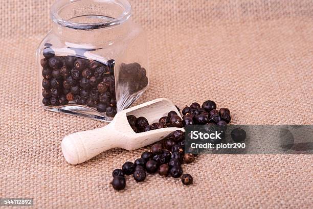 Juniper In Measuring Containers With A Wooden Scoop Stock Photo - Download Image Now