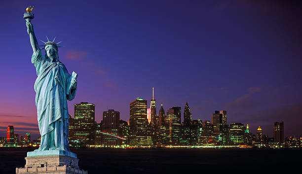 istock Manhattan skyline at night and Statue of Liberty. 544114330