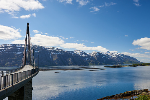 View of Helgeland Bridge and the seven sisters mountain range in SandnessjÃ¸en, Norway.