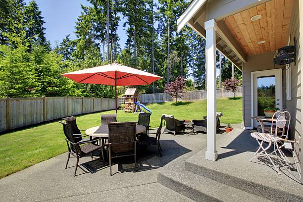 istock Spacious fenced backyard area with patio 544116370