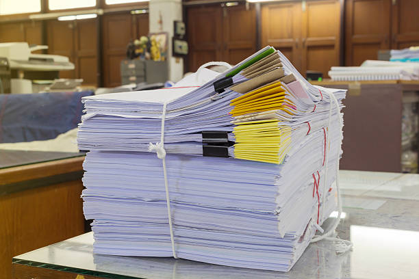 istock Pile of documents on desk at workplace 544118110
