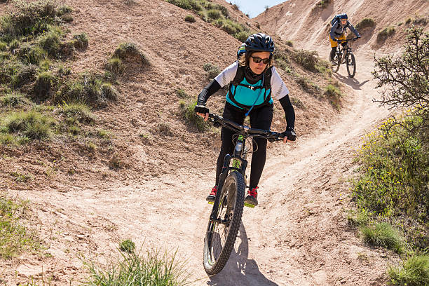 istock Female mountainbikers in Cappadocian S-shape curve, Turkey 544121830