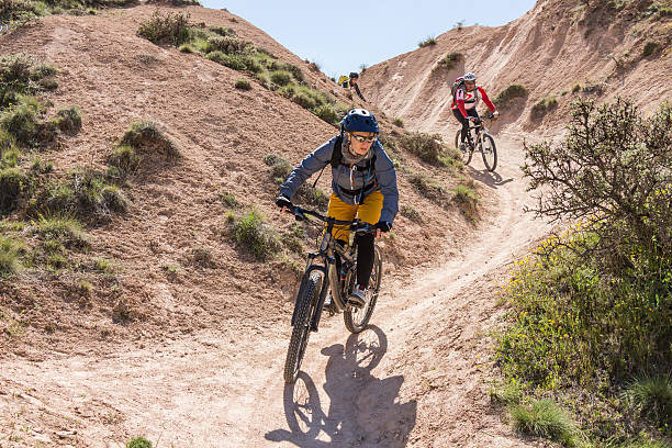 istock Three mountainbikers in Cappadocian S-shape curve, Turkey 544124752