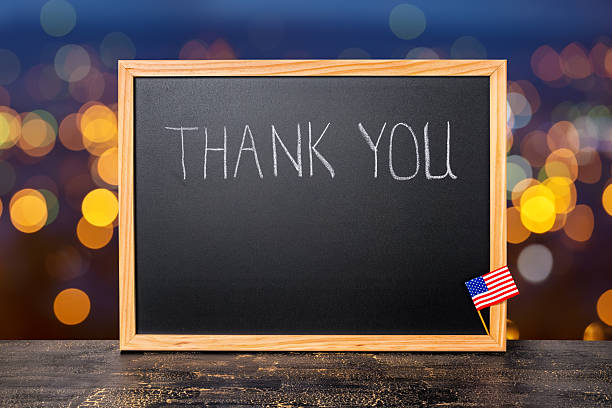 istock handwriting text thank you is written in chalkboard with flag 544126004