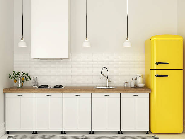 istock Kitchen with white furniture and a yellow fridge 544126650