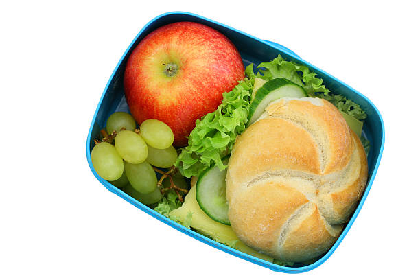 istock Lunch box containing cheese sandwich and fruit isolated on white 544128062