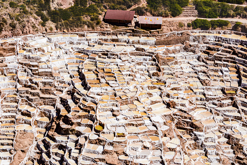 Salt evaporation ponds of Maras, Peru.  Maras is a town in the Sacred Valley of the Incas in the Cuzco Region of Peru. The evaporation ponds have been in use since before Inca times. The salt-evaporation ponds are up-slope, less than a kilometer west of the town.
