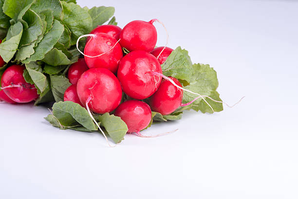 istock Fresh radishes on old wooden boards 544128438