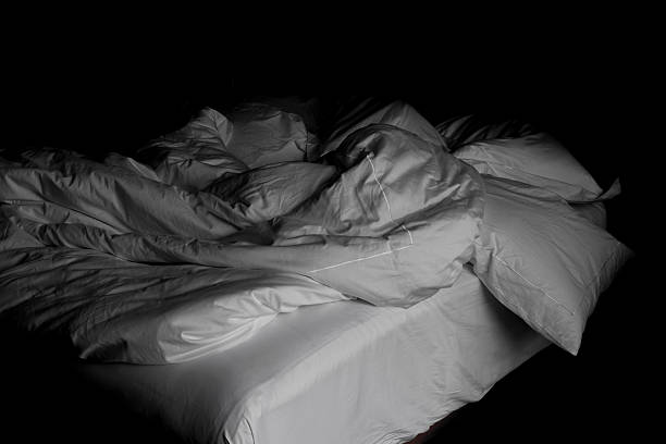 istock Messy white bed and pillow, in the morning 544129406