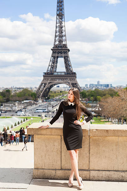 istock Attractive Young Woman Standing At Eiffel Tower in Summertime 544131736